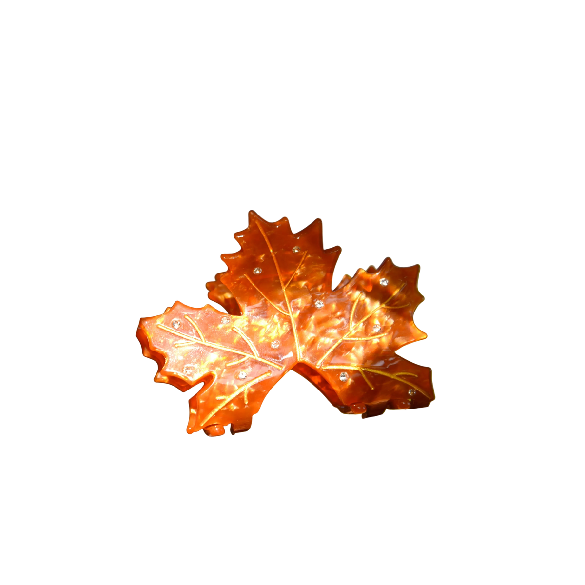 Decorative orange leaf on a branch with a blurred natural background