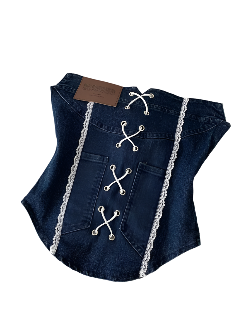 Denim corset with lace details on a white surface