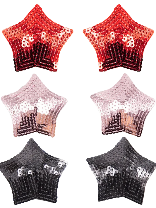Six star-shaped sequin accessories arranged in a 3-by-2 grid on a white background, showing red-to-black ombre, blush-to-silver ombre, and black-to-silver ombre designs.