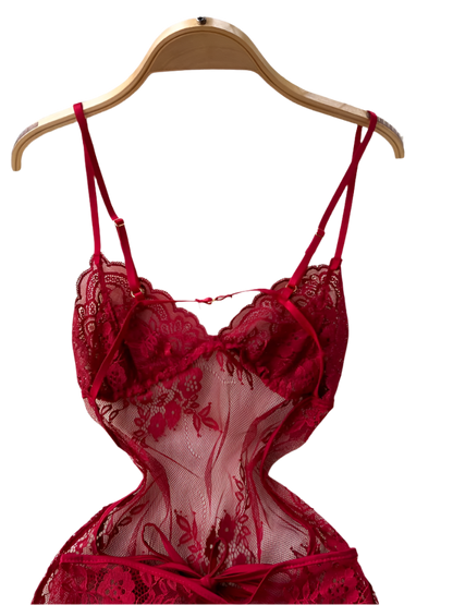 Red lace lingerie set on a hanger against a white textured background