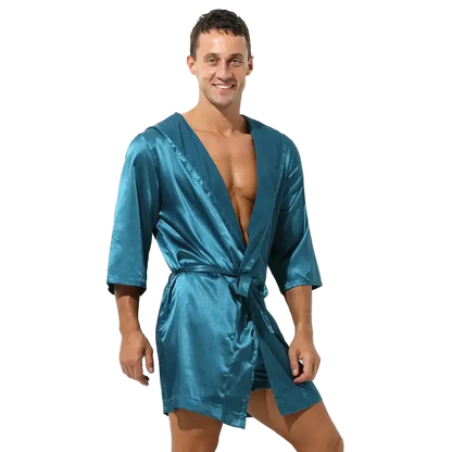 Man wearing a teal satin robe on a white background