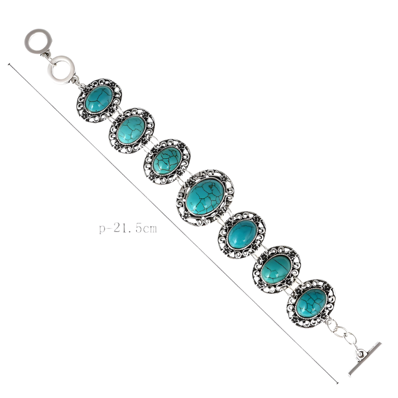 Bracelet with turquoise stones and silver accents on a white background