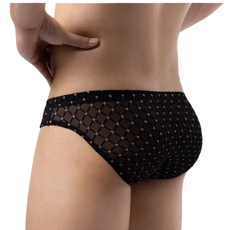Rear view of a model wearing black mesh bikini-style underwear with a diamond net pattern and small gold dot accents, against a plain white background.
