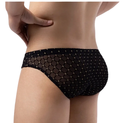 Rear view of a model wearing black mesh bikini-style underwear with a diamond net pattern and small gold dot accents, against a plain white background.