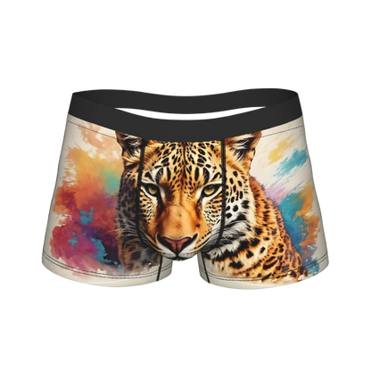 Men's boxer briefs featuring a realistic leopard print graphic on a colorful watercolor background, with a solid black elastic waistband.