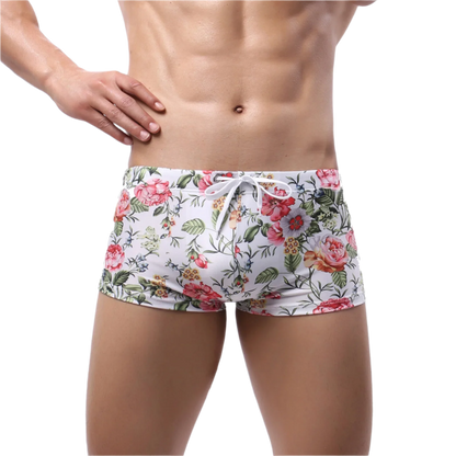 Floral-patterned boxer briefs with tropical leaf and flower design.