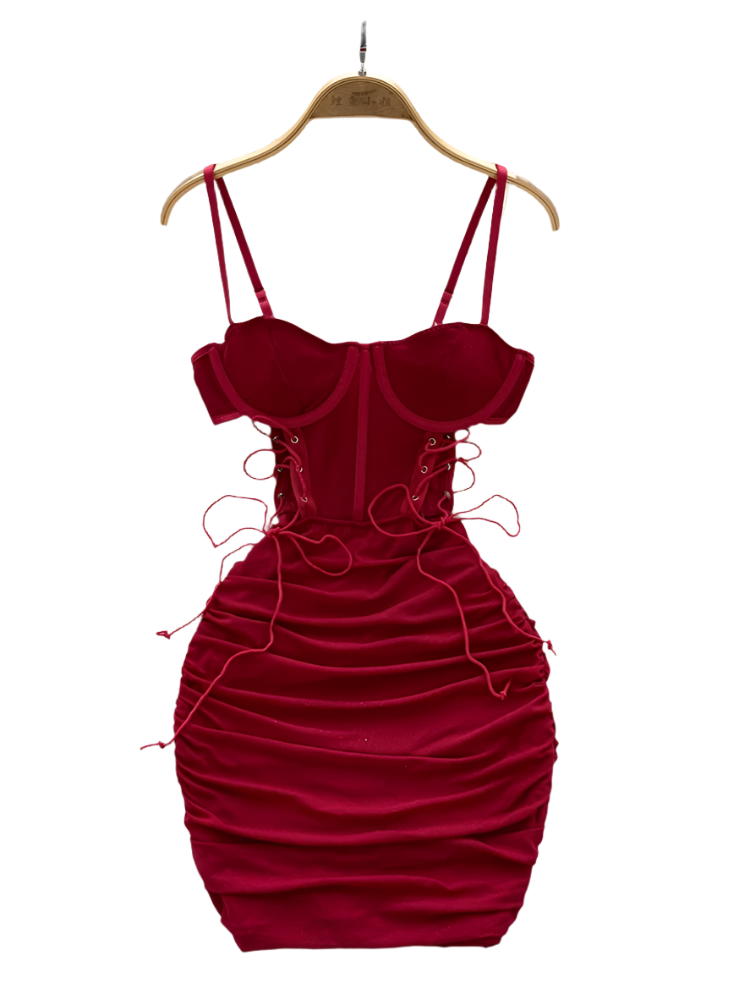 Red velvet dress on a hanger with a white floral background