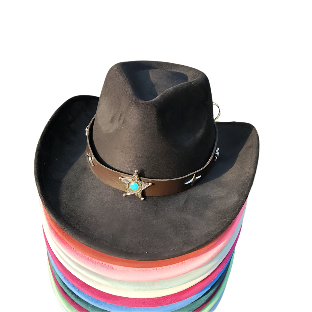 Stack of colorful hats with a black cowboy hat on top on grass