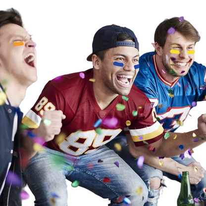 Three men celebrating indoors with colorful confetti falling around them. The central man wears a burgundy football jersey with large white and gold numbers, blue face paint, and a dark cap, while the men on either side wear blue and red sports jerseys.