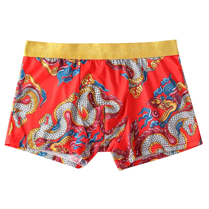 Red shorts with dragon pattern and gold waistband on a white background