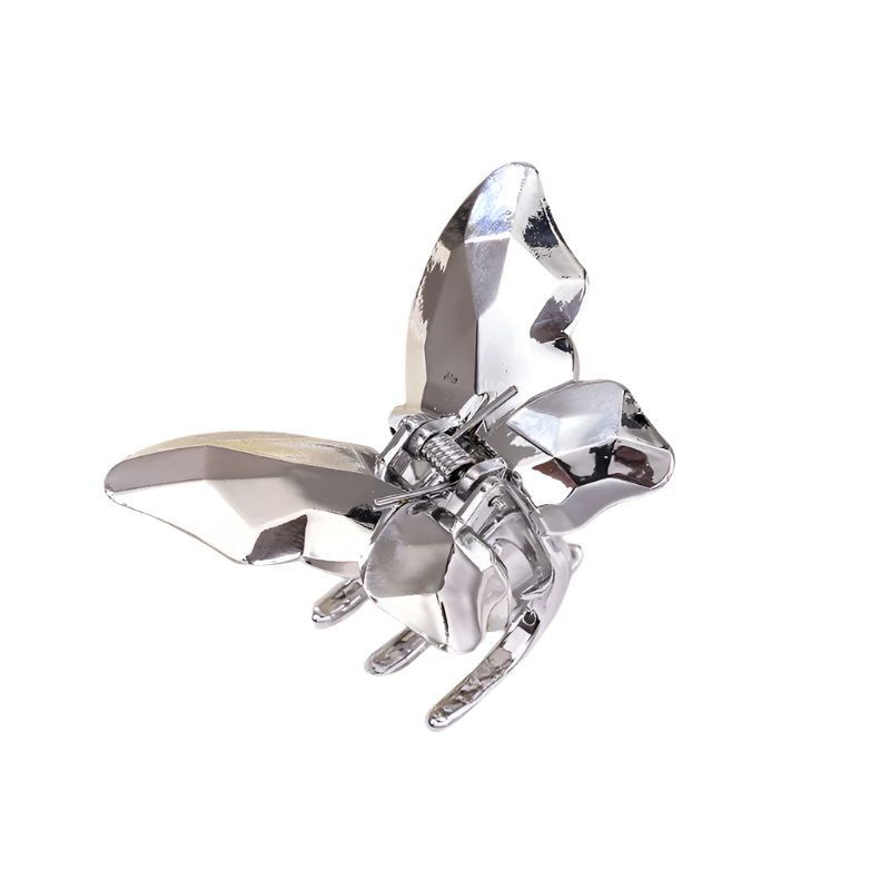 Silver butterfly hair clip on a white background