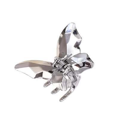 Silver butterfly hair clip on a white background