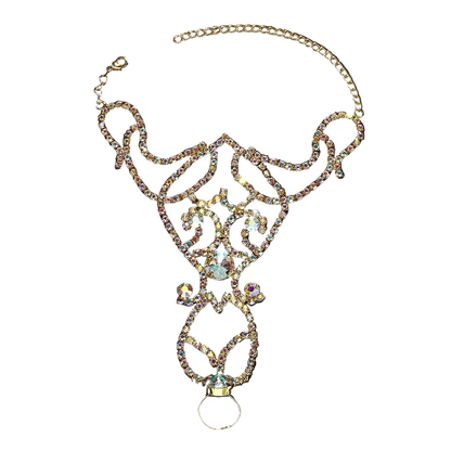 Gold-tone filigree collar necklace embellished with clear rhinestones and featuring a large central iridescent crystal, displayed on a dark background.