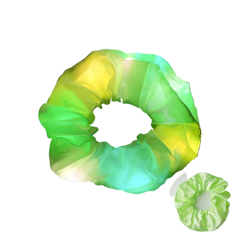 Glowing green and yellow scrunchie on a dark background