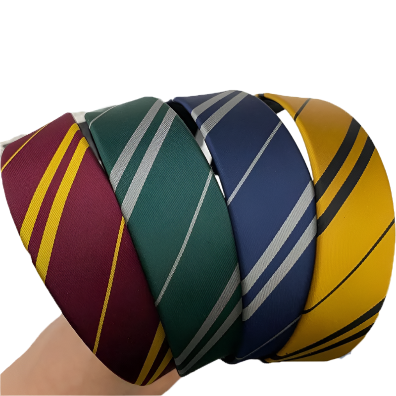 Ball made of interwoven ties in red, green, blue, and yellow colors on a white background