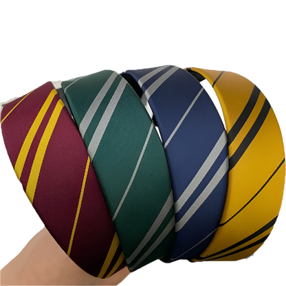 Ball made of interwoven ties in red, green, blue, and yellow colors on a white background