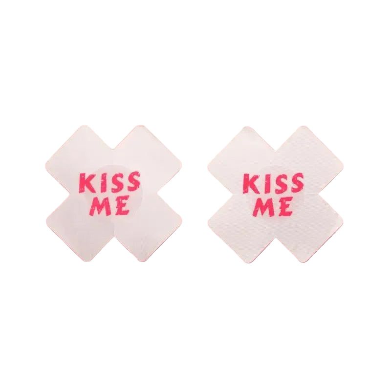 Two white napkins with 'KISS ME' text on a pink background