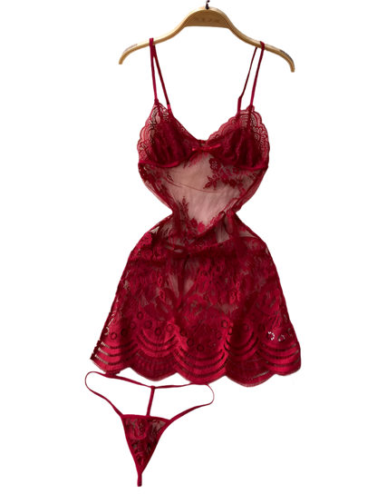 Red lace lingerie set on a hanger against a textured white surface with floral decorations.