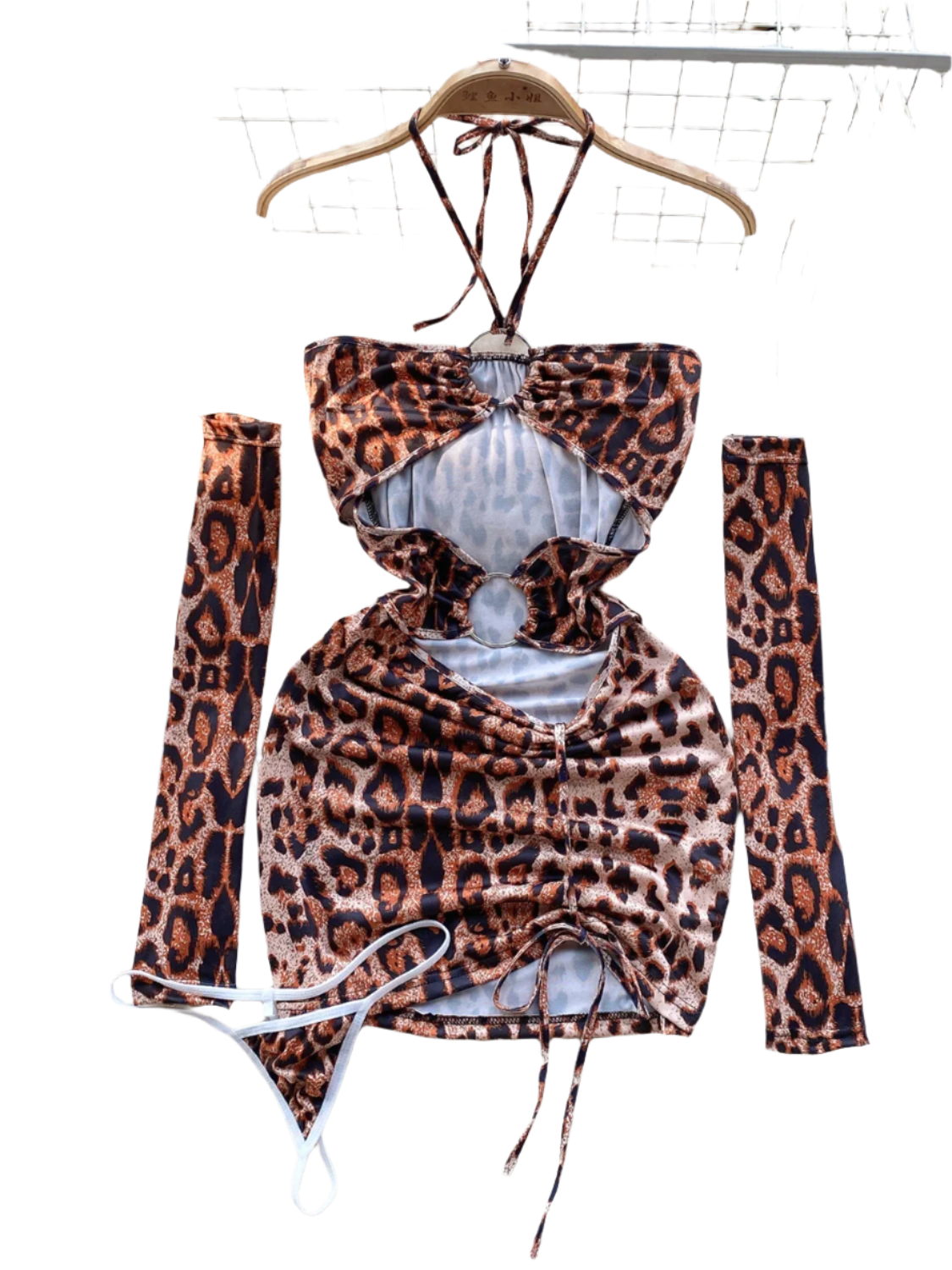 A leopard  print dress with cut-out sections and ruching. It features a halter neck and matching arm sleeves, creating a wild and daring style.