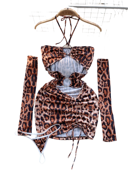 A leopard  print dress with cut-out sections and ruching. It features a halter neck and matching arm sleeves, creating a wild and daring style.