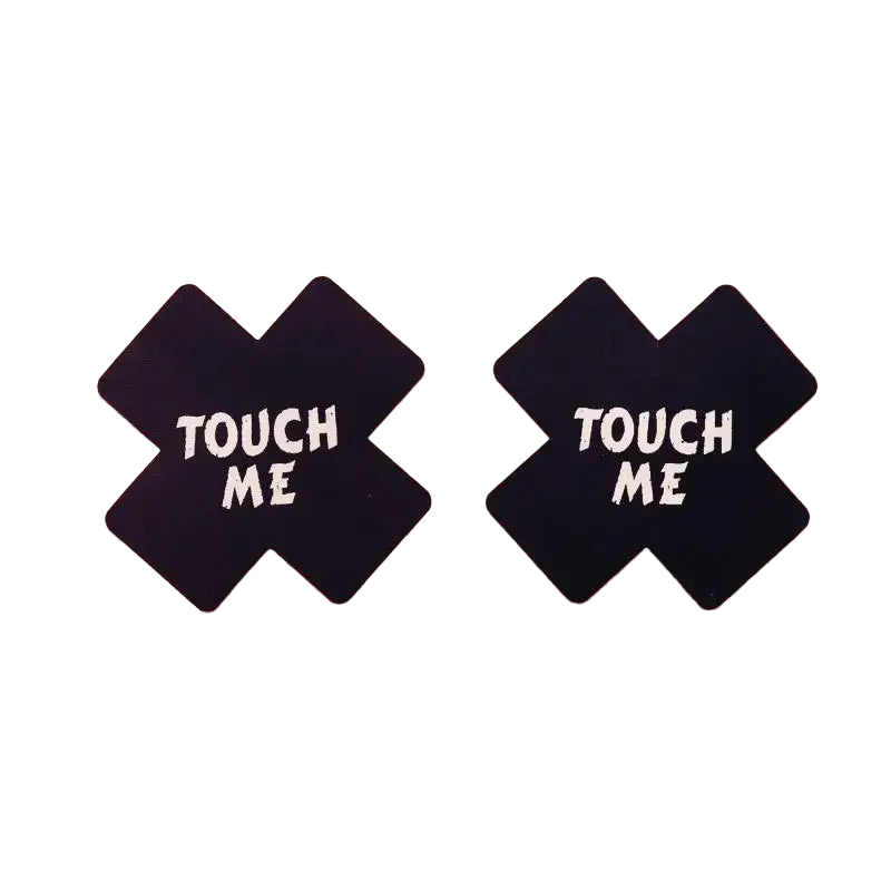 Black 'TOUCH ME' signs with crosses on a pink background