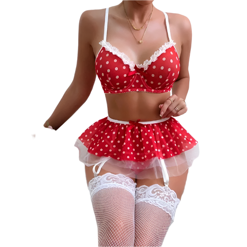 Person wearing a red polka dot lingerie set with white stockings on a white background, holding pink roses.