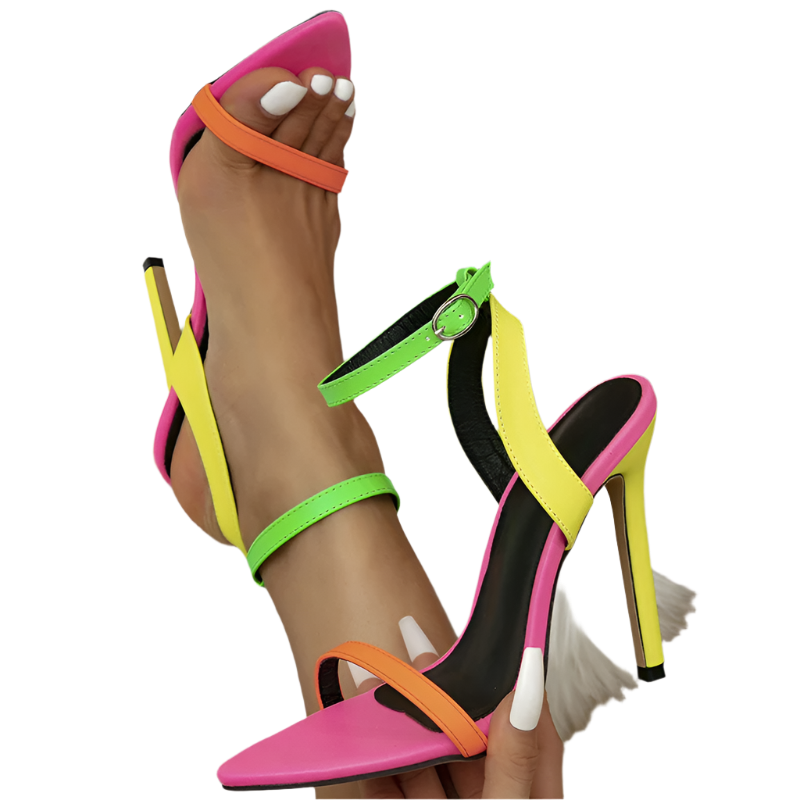 Colorful high-heeled sandals with neon straps on a white fur surface.