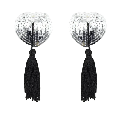 Pair of earrings with silver circular designs and black tassels on a white background