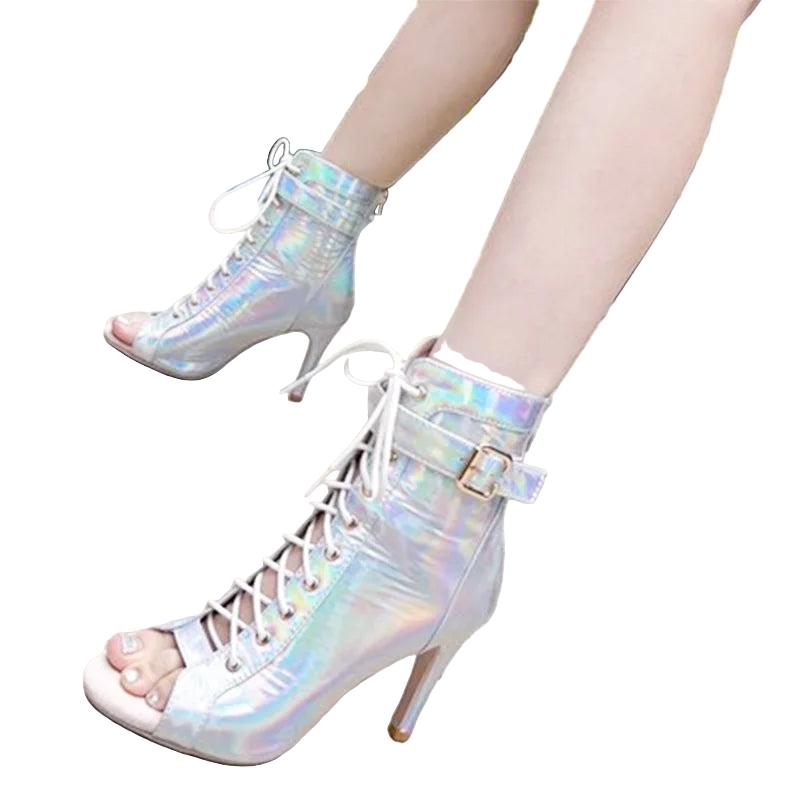 Holographic high-heeled boots worn by a person on a pavement.