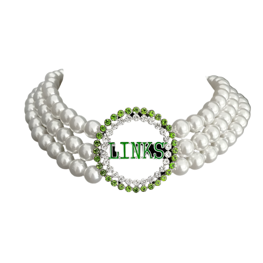 Pearl necklace with a green and silver 'LINKS' pendant on a black background