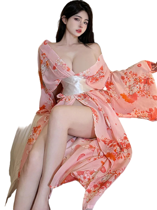 Woman in a floral dress sitting on a bed