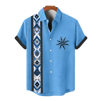 Blue short-sleeve shirt with a sun design on a hanger against a white background