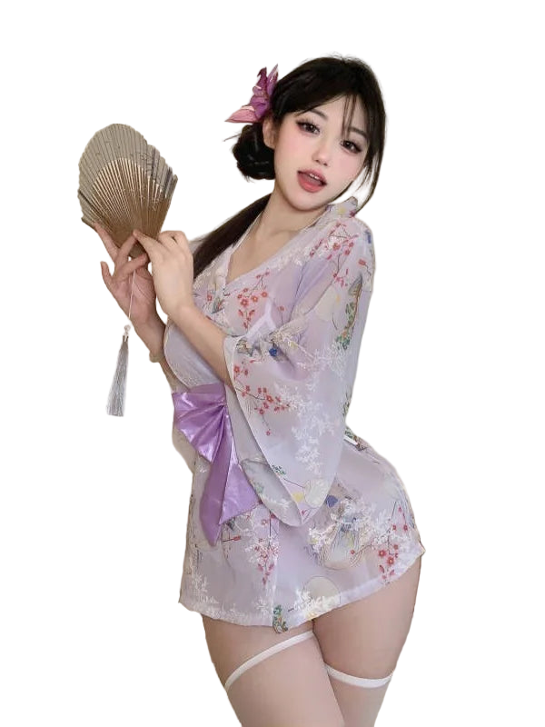 Woman in a floral kimono holding a fan in a bedroom setting