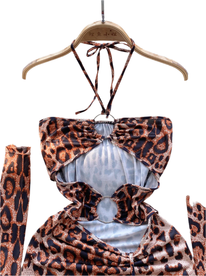 A leopard print dress with cut-out sections and ruching. It features a halter neck and matching arm sleeves, creating a wild and daring style.