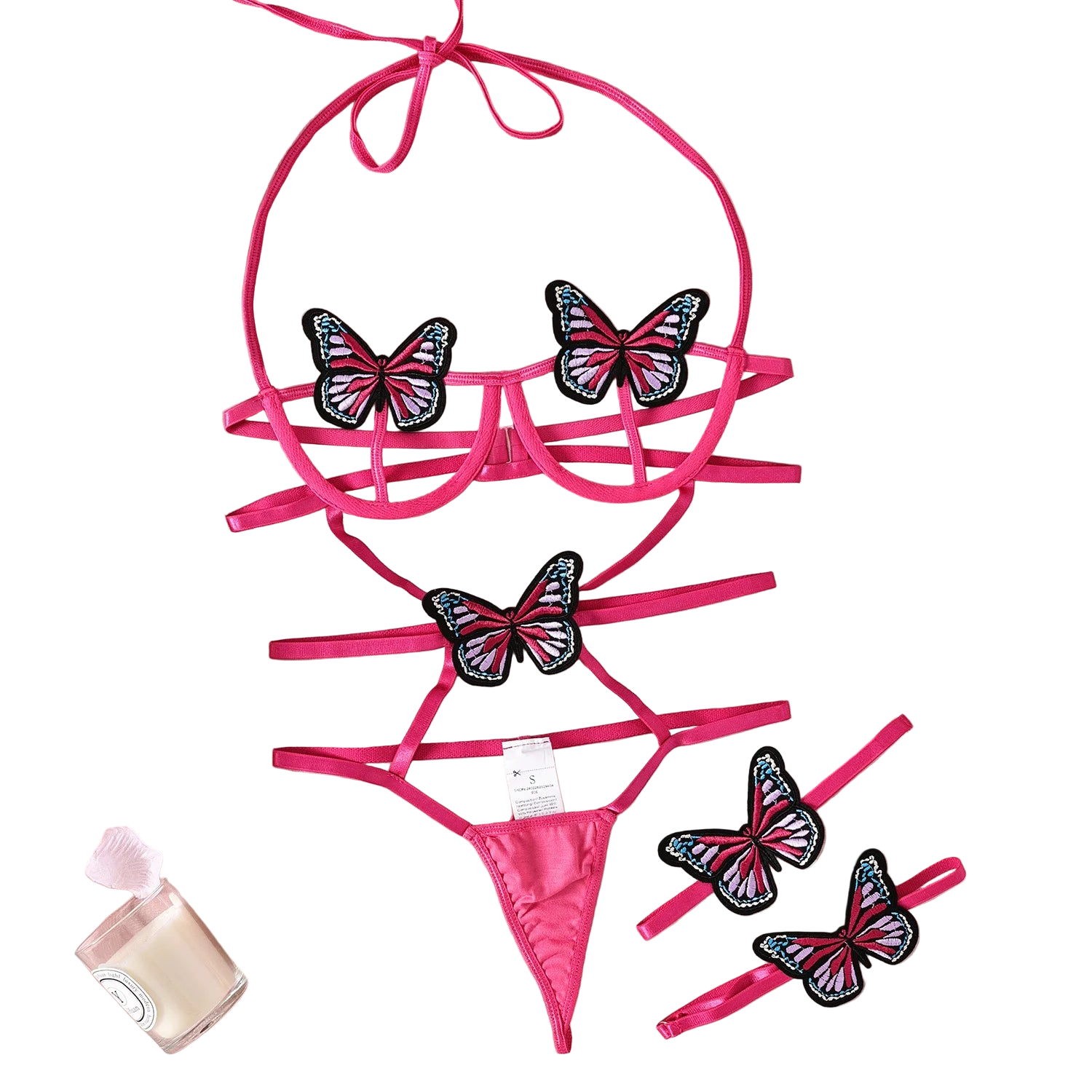 Pink bikini set with butterfly designs on a pink fabric background
