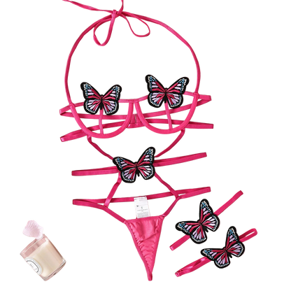 Pink bikini set with butterfly designs on a pink fabric background