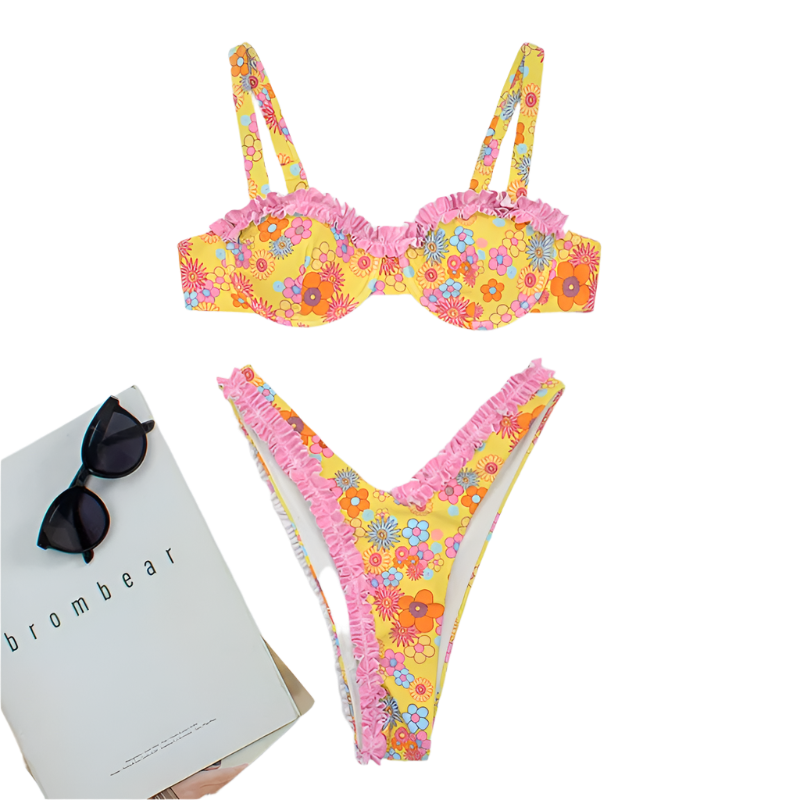 A vibrant bikini set with a yellow floral pattern and pink ruffle trim. The top has structured cups and adjustable straps, while the bottom features a high-cut design.