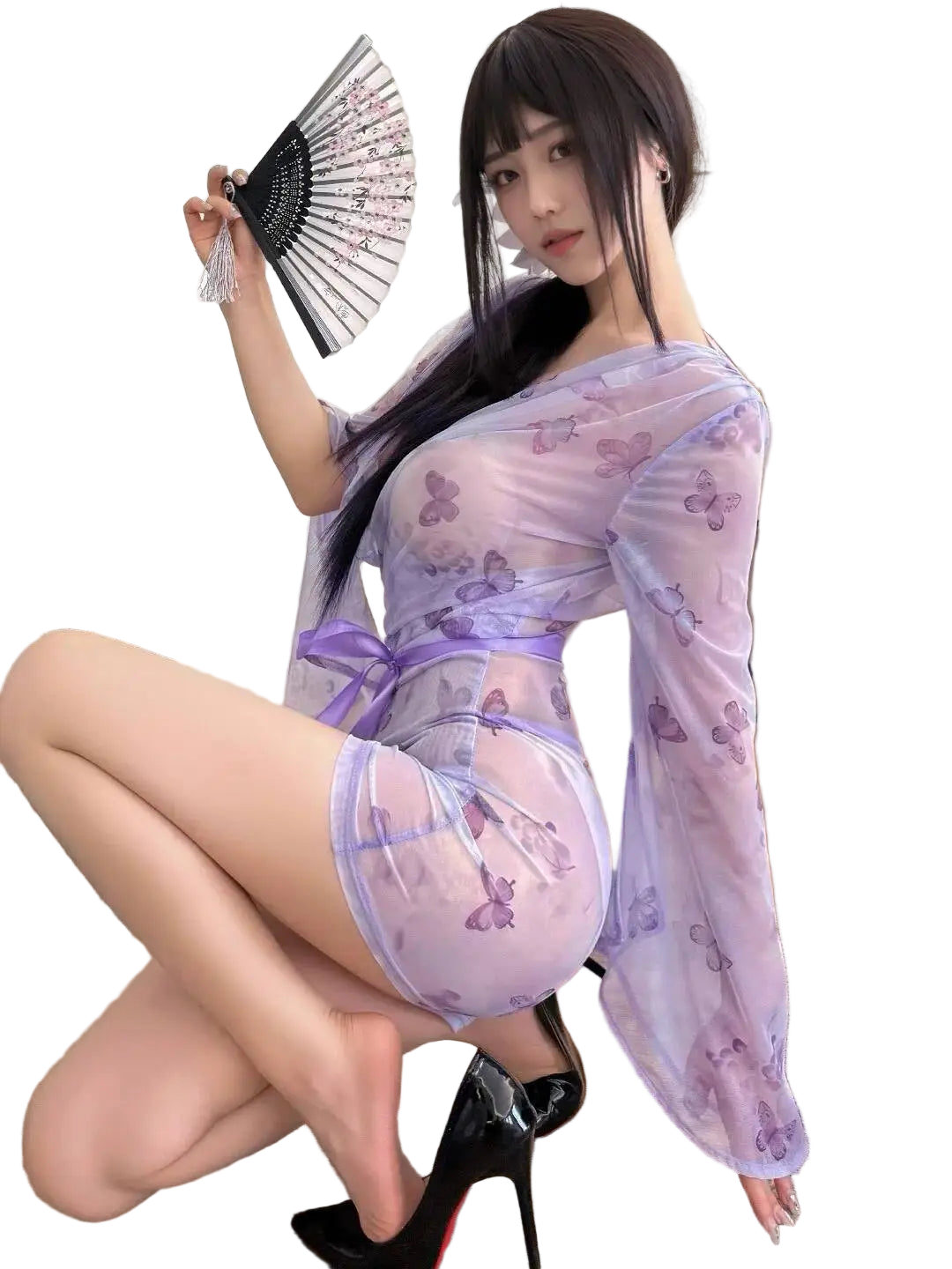 Woman in a sheer, light purple outfit with butterfly patterns in an indoor setting.