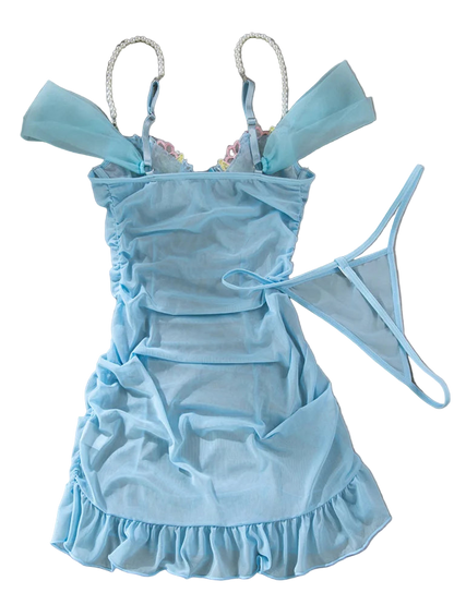 Light blue babydoll dress with ruffled details on a gray background
