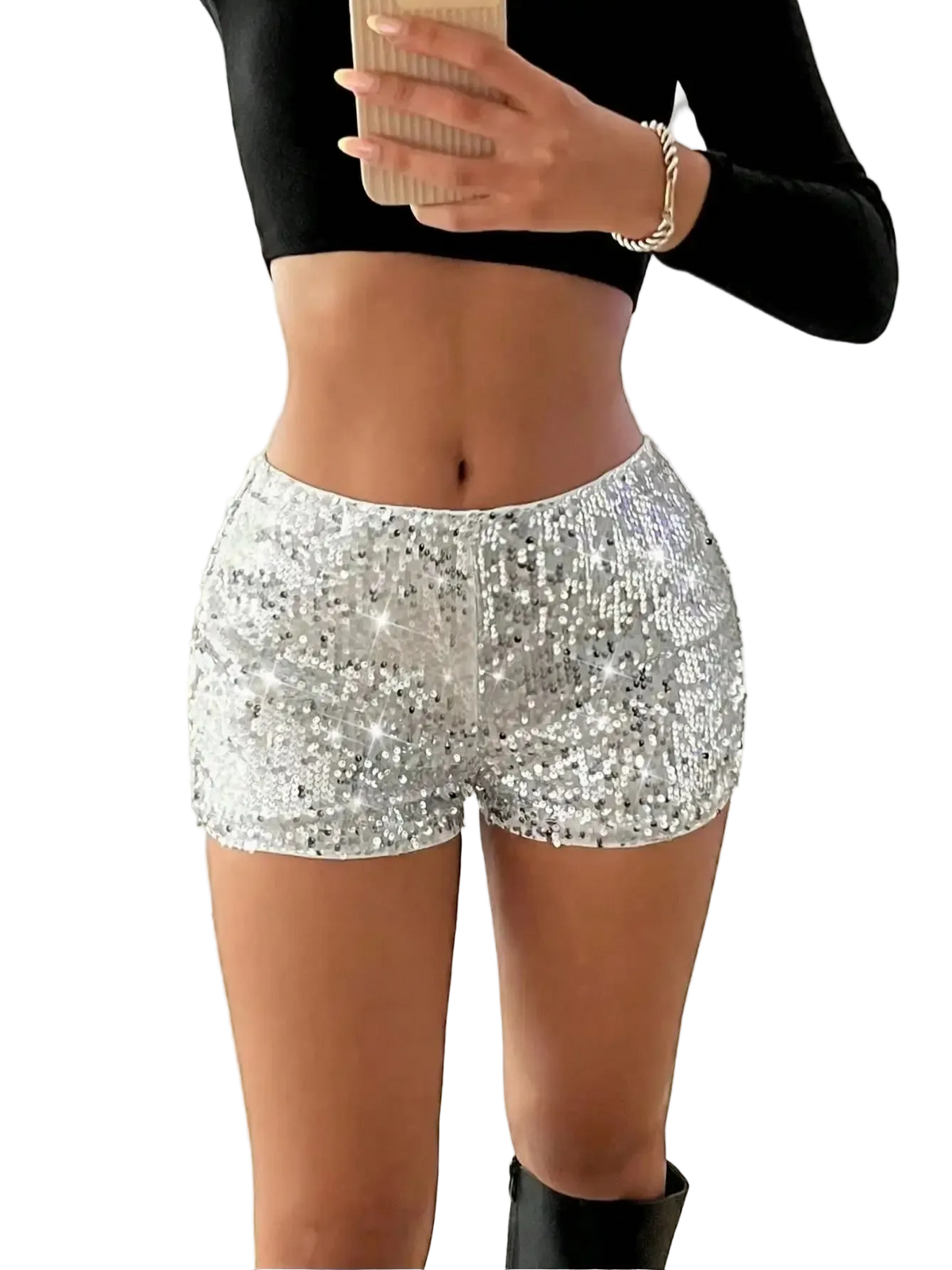 Person wearing silver sequin shorts and a black top indoors.