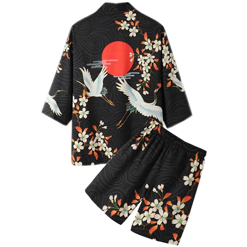 Black kimono-style outfit with crane and floral patterns on a white background