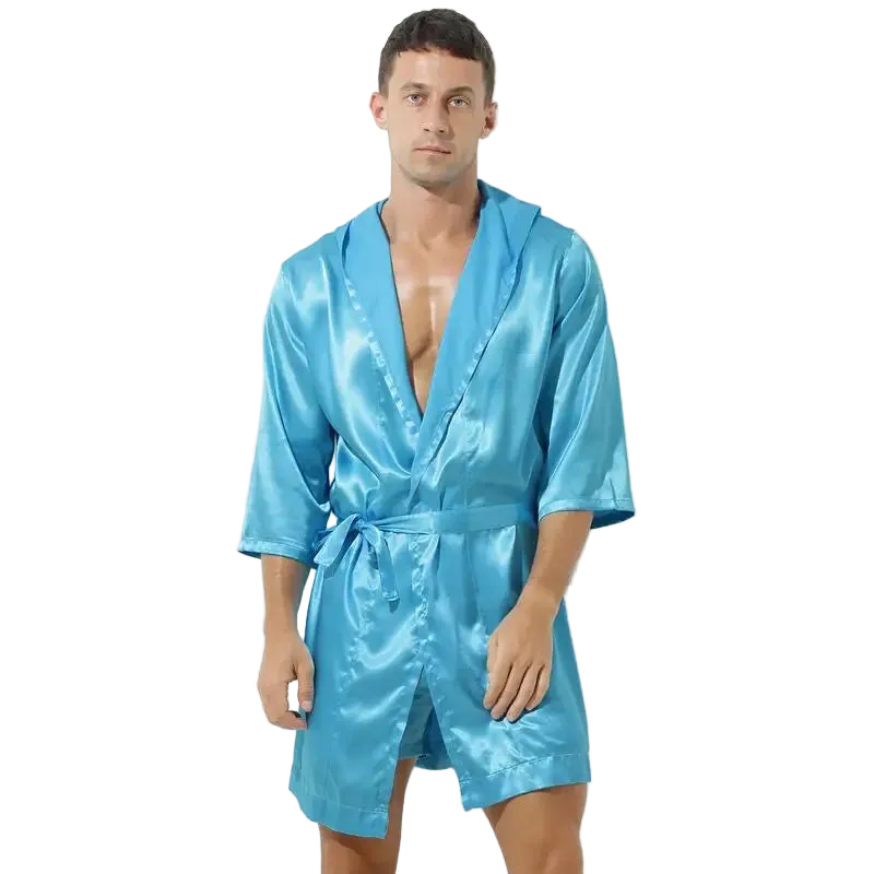 Man wearing a blue satin robe on a white background
