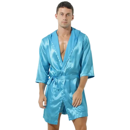 Man wearing a blue satin robe on a white background