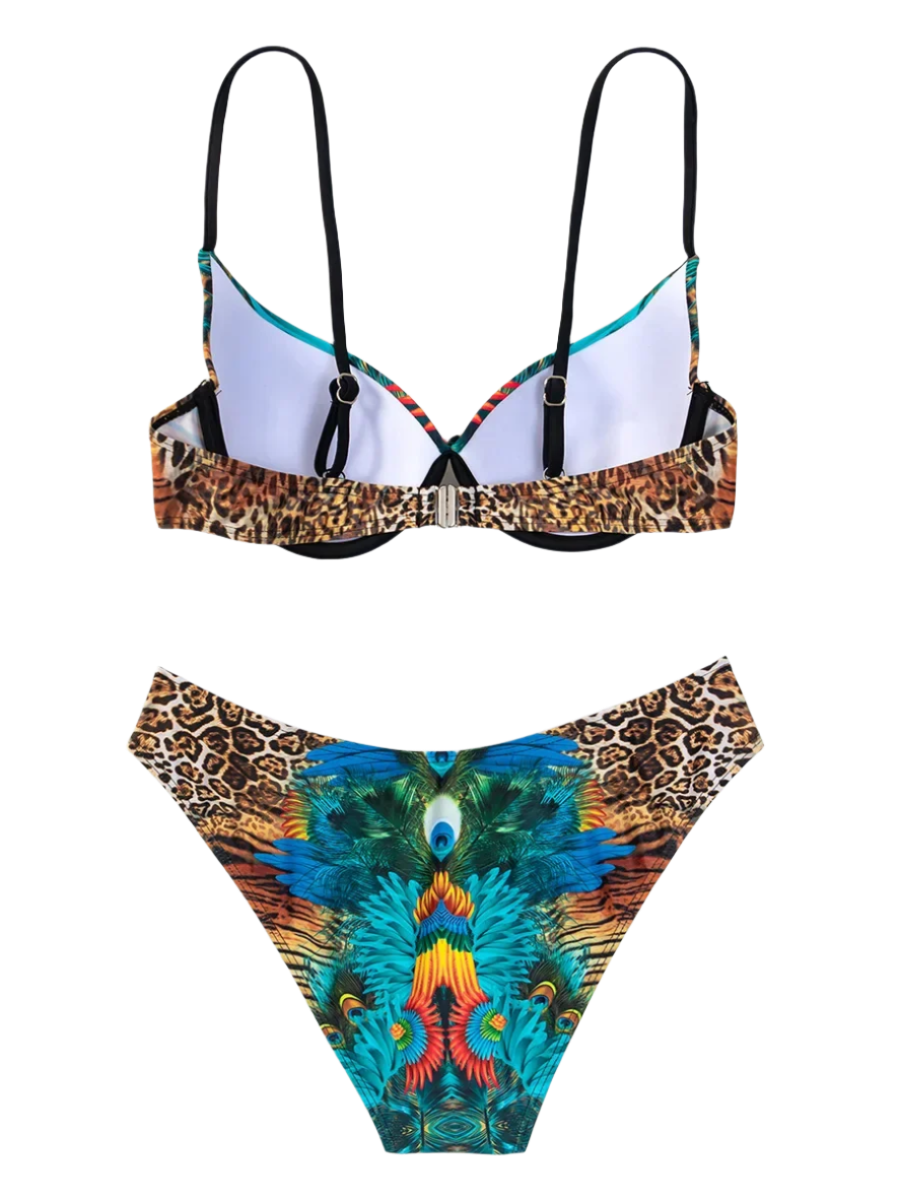 A bikini with a vibrant peacock feather print and jewel embellishments. The design is exotic and eye-catching, perfect for a bold beach look.