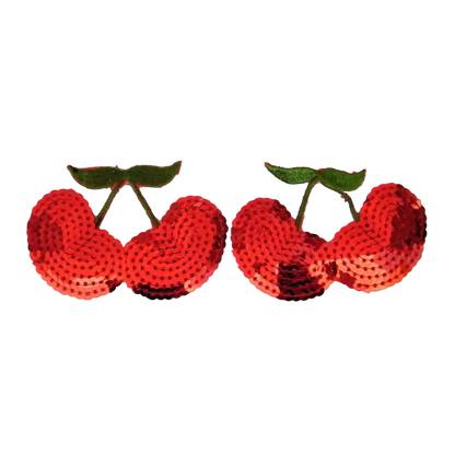 Pair of red sequin cherries on a white background