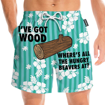 Beach shorts with a humorous design and text on a floral background.