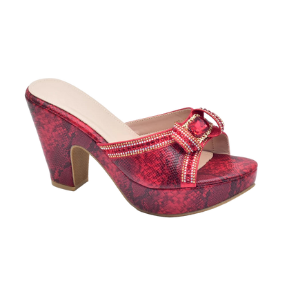 Red platform sandal with embellishments on a white background