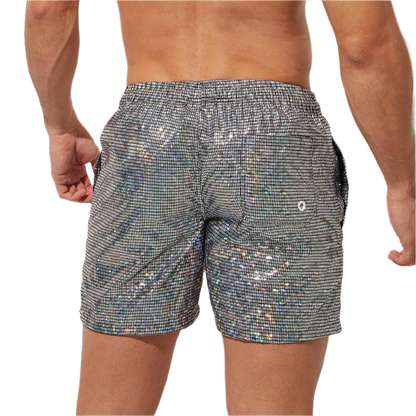 Silver holographic swim shorts with drawstring, perfect for a stylish beach day at the resort.