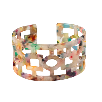 Bold leopard print wide cuff bangle featuring hollow geometric patterns and premium resin design for resort wear and theme nights

