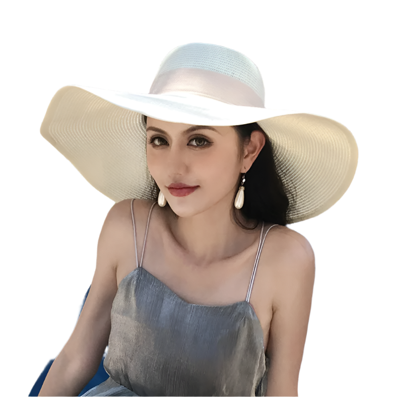 Woman wearing a wide-brimmed hat sitting on a blue chair outdoors.